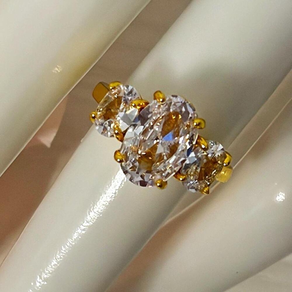 18k gold plated ring with 3 prong CZ diamonds
